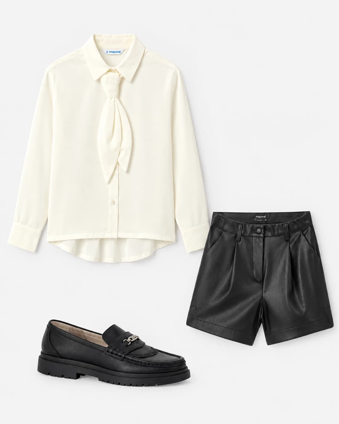 Κομψότητα, attitude και σύγχρονο στιλ σε ένα outfit! ✨ Η εκρού μπλούζα με τον εντυπωσιακό φιόγκο συναντά το μαύρο leather-look σορτς και τα chunky loafers, δημιουργώντας ένα μοντέρνο σύνολο που μαγνητίζει τα βλέμματα. Ιδανικό για κορίτσια που αγαπούν τις fashion-forward εμφανίσεις και ξεχωρίζουν σε κάθε περίσταση! 🤍🖤